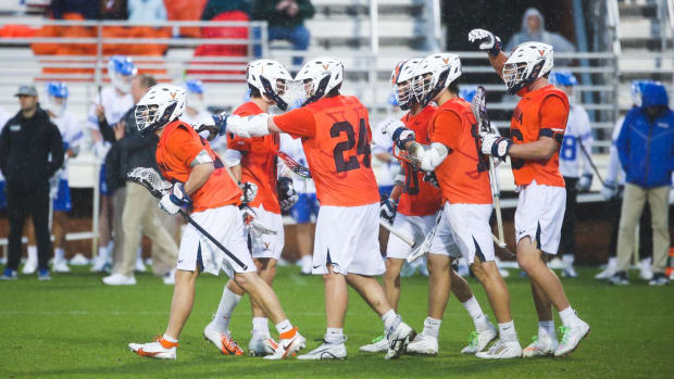 The Virginia men's lacrosse team celebrates after scoring a goal against Duke at Klockner Stadium.